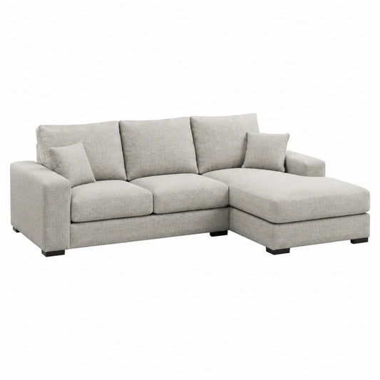 Divano angolare in tessuto grigio con chaise longue